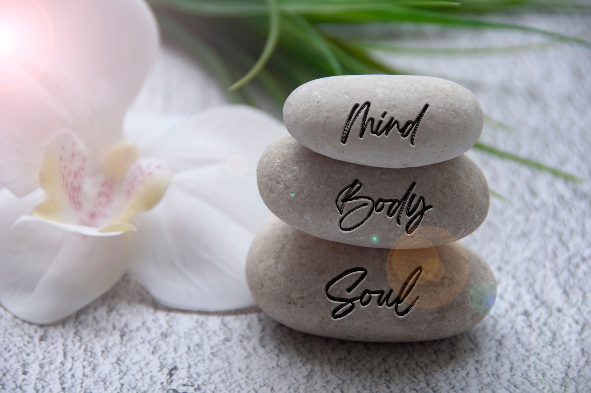 Mind, Body and Soul words engraved on zen stones with space for text. Health life concept